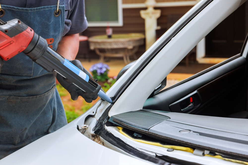 Technician doing Windshield Replacement